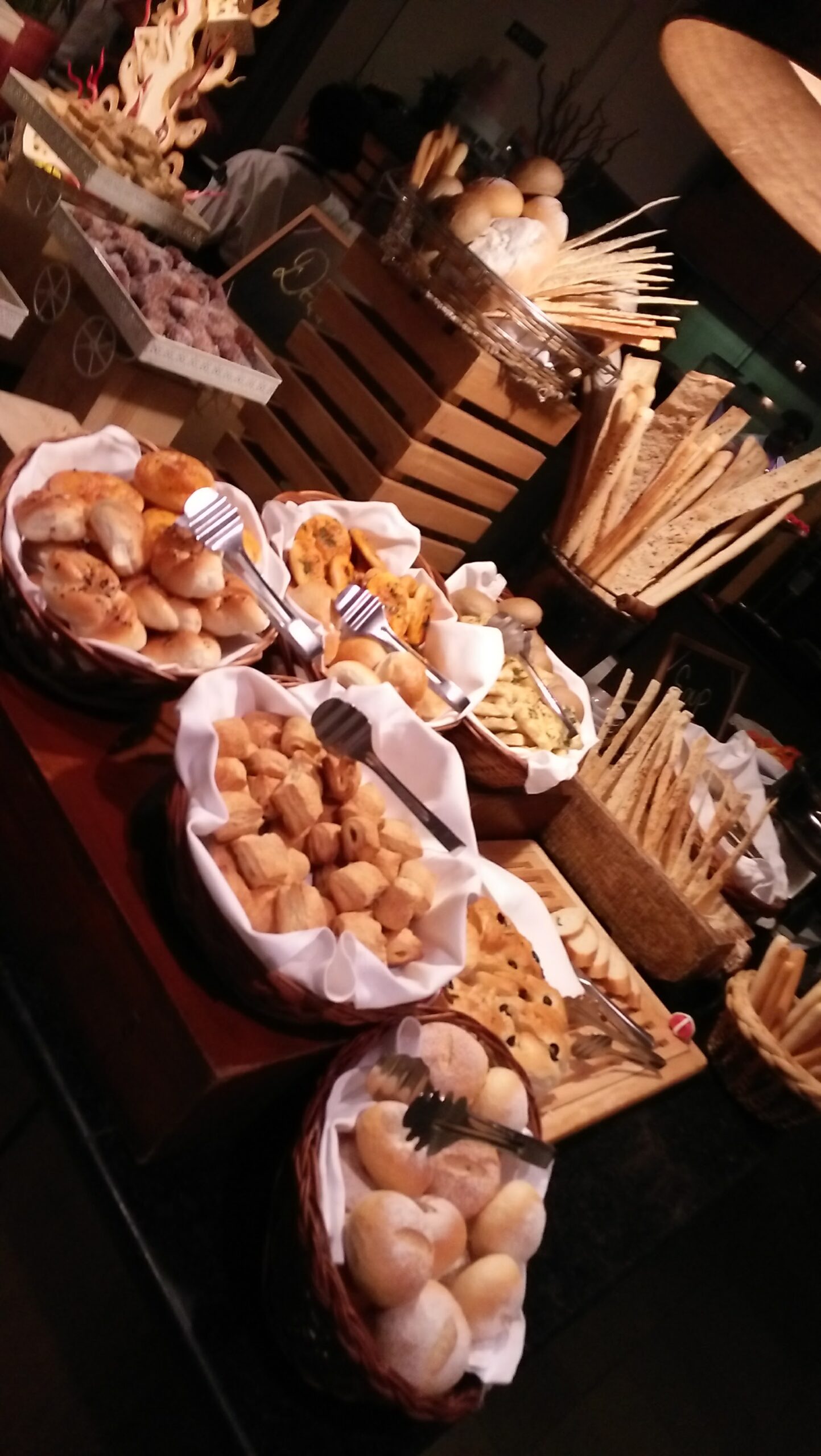 Artisan bread and rolls basket display from hotel bakery