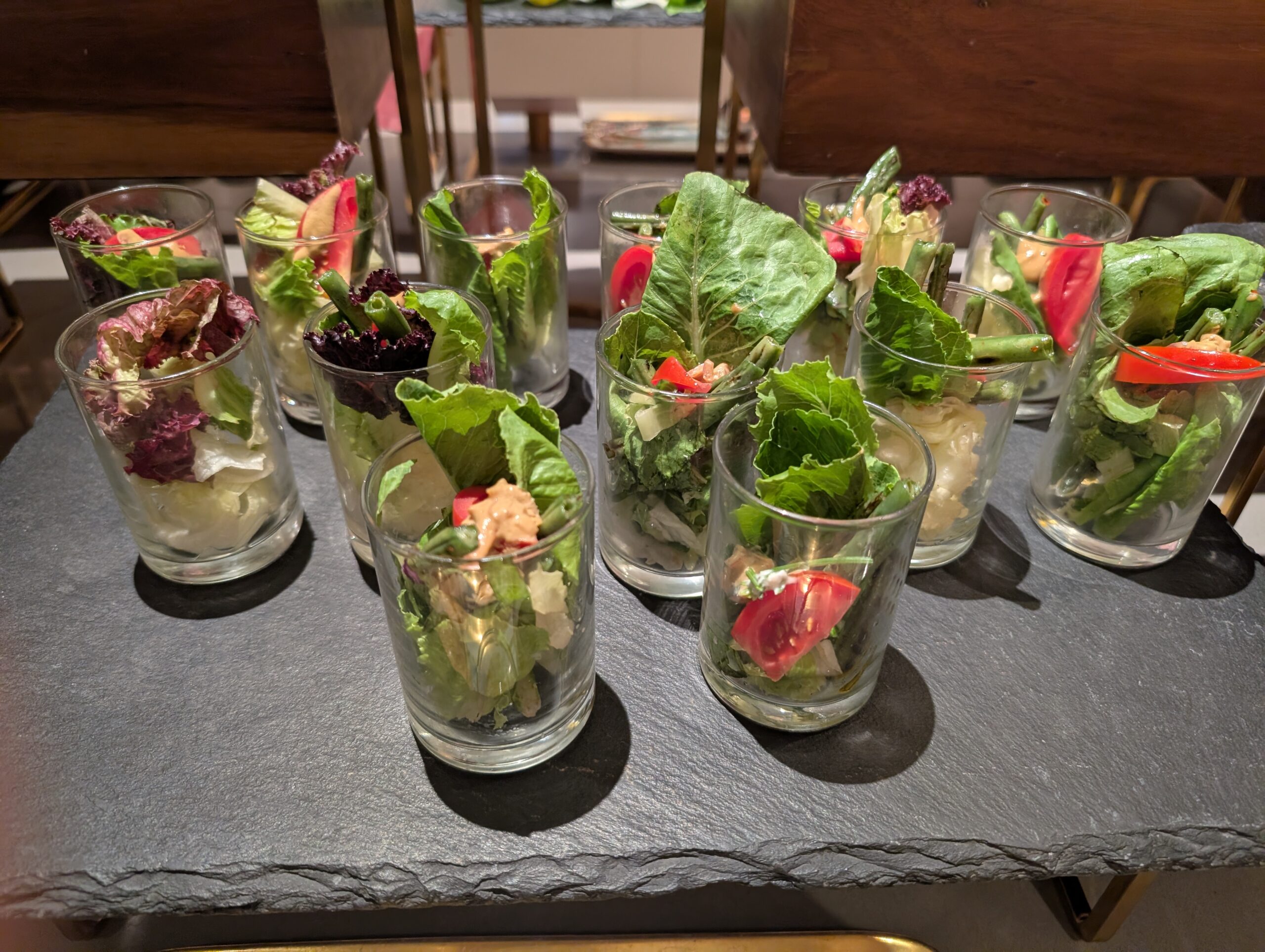 Professional cheese and fresh salad display — salt balance across textures