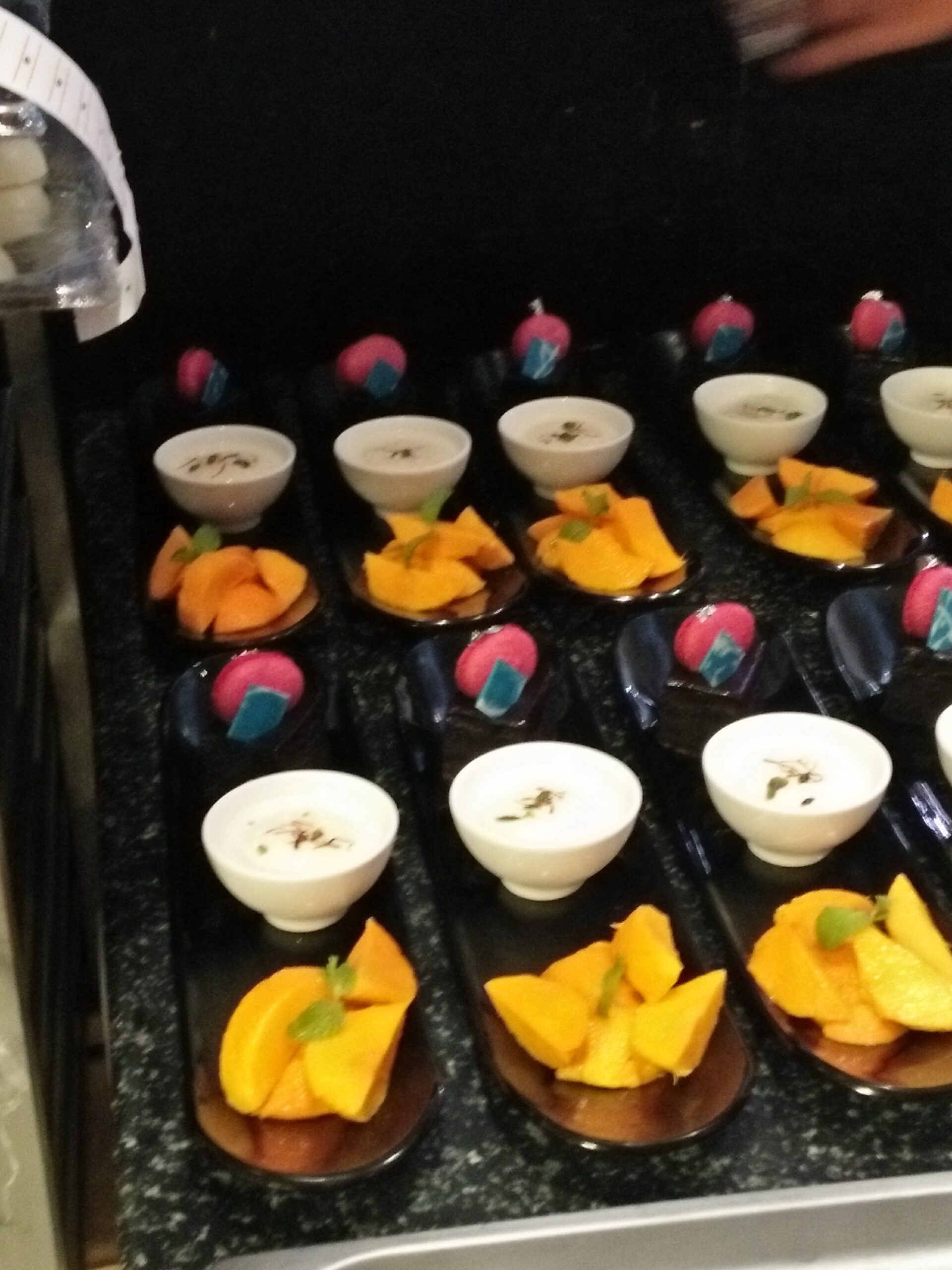 Beautifully organised individual dessert cups showing pastry mise en place